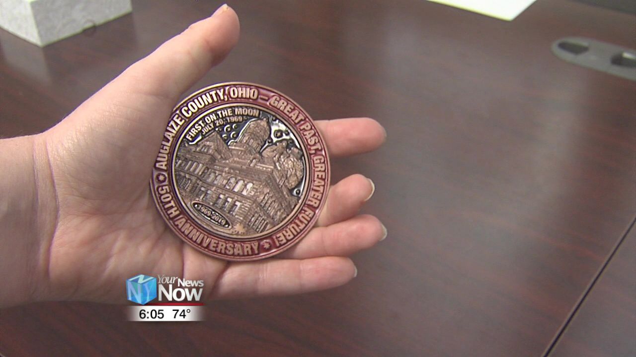 Auglaize County Commissioners unveil 50th Anniversary medallion.jpg